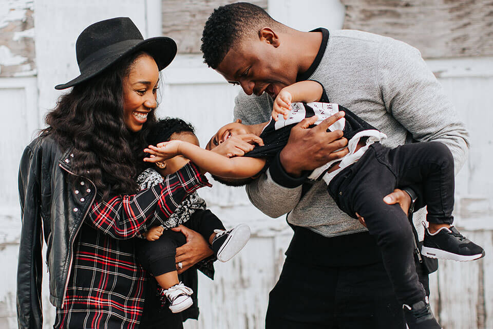 Black family holding babies