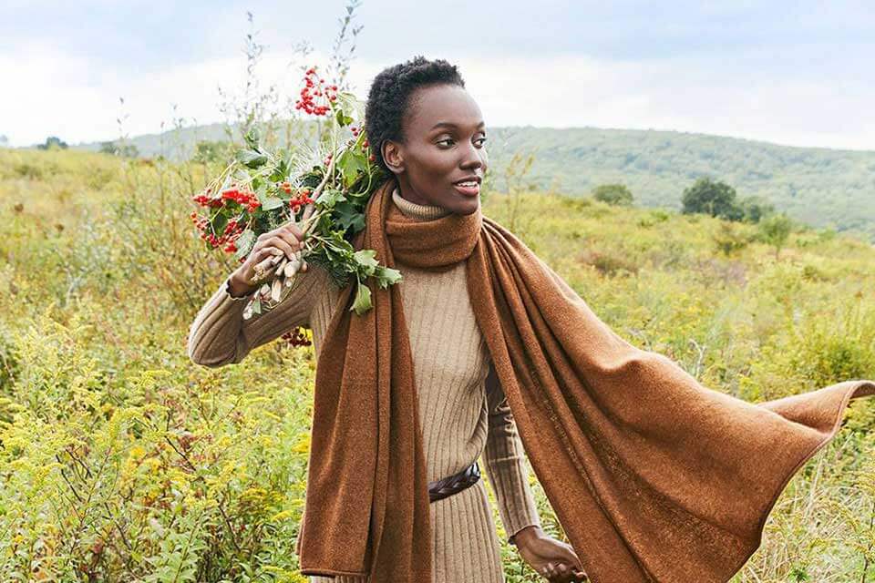 Woman in a long scarf in a field