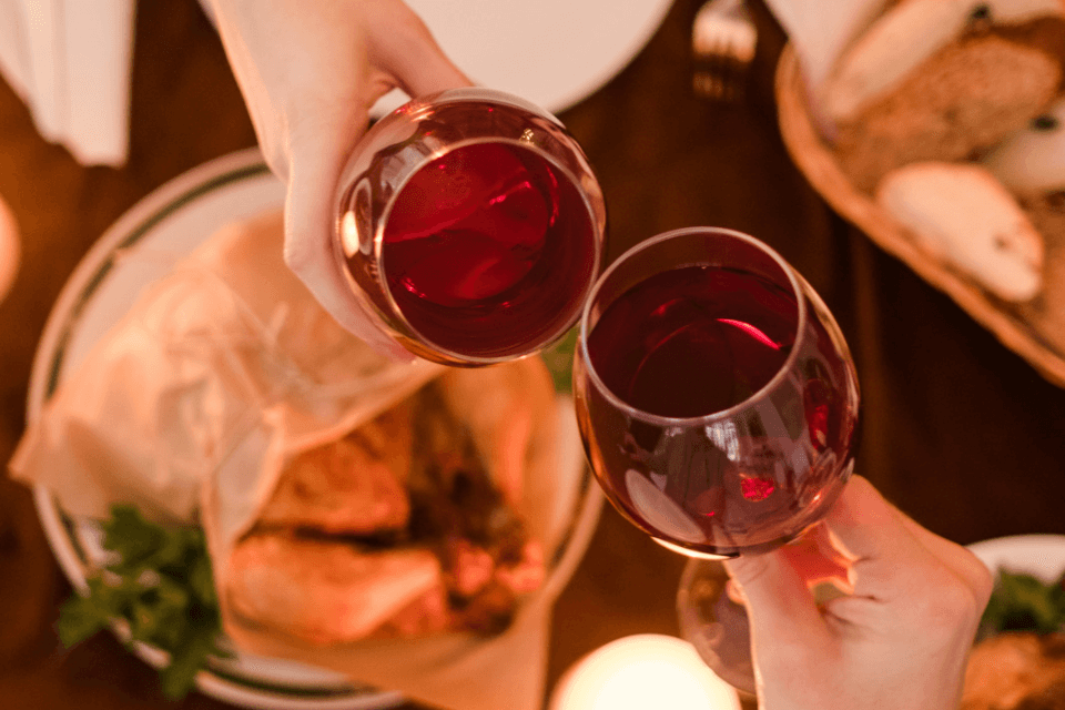 Photo of wine glasses clinking